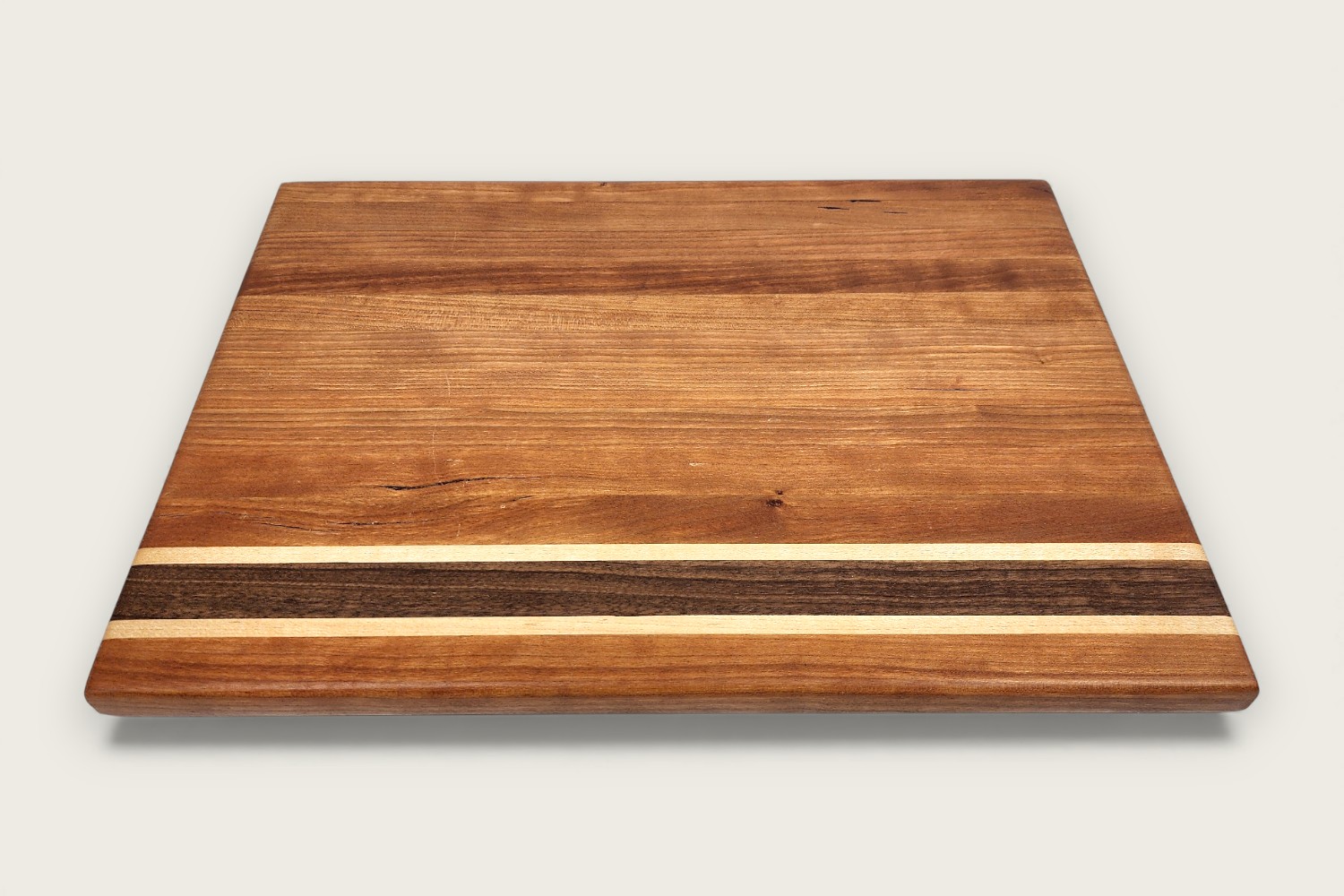 Cherry Hearthwood Prep Board (#230) with edge-grain cherry wood, warm amber tones, and a rectangular shape.